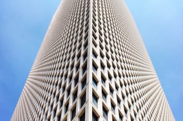 architectural and low-angle photo of white high rise building